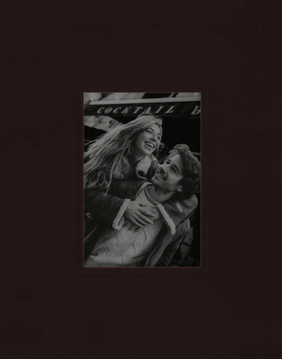 Couple photoshoot in Madrid, laughing together in the street, by photographer Nina Volpini