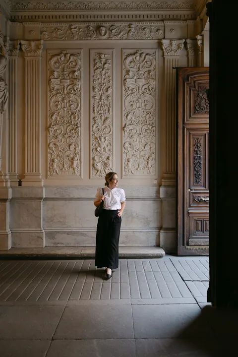 Woman in a historic palace in Madrid during a solo photoshoot